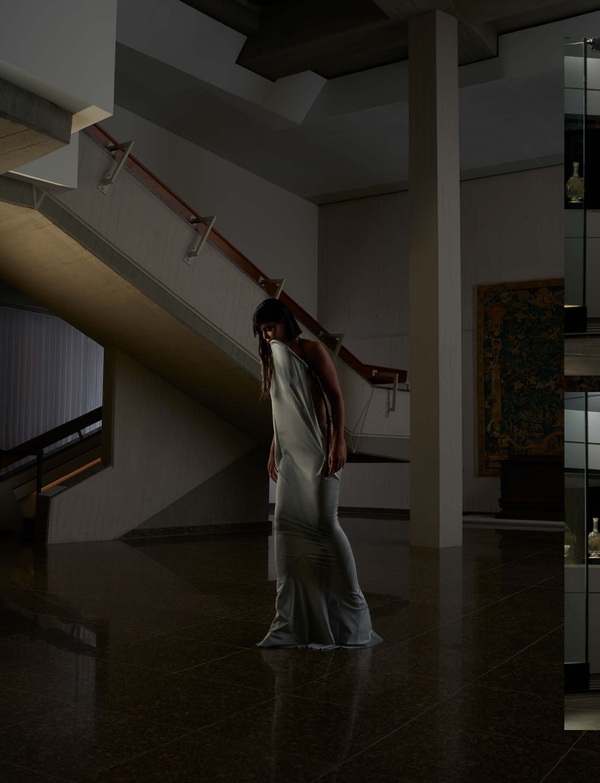 Figure on the museum staircase wearing contemporary fashion