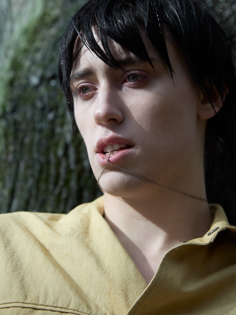 Portrait in a pale yellow shirt with sunlight across the face