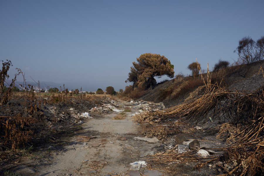 Discarded waste along a dirt track in the outskirts of Naples