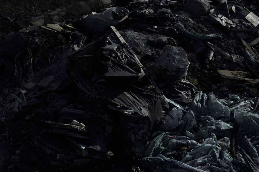 Close view of burned and discarded waste